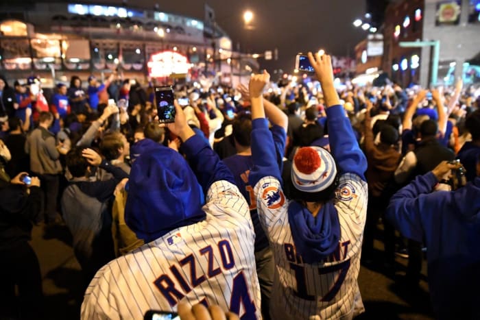 Chicago Cubs fans celebrate after game seven of the 2016 World Series against the Cleveland Indians outside of Wrigley Field. Cubs won 8-7.